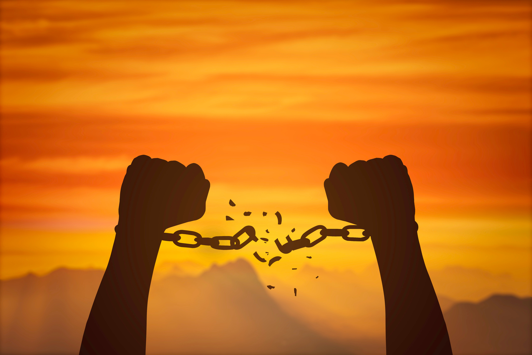 silhouette hands and broken chains .Freedom concept
